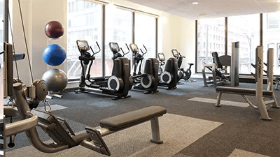 Exercise machines weights and balls gym area at INFINITE in Chicago Student Accommodation
