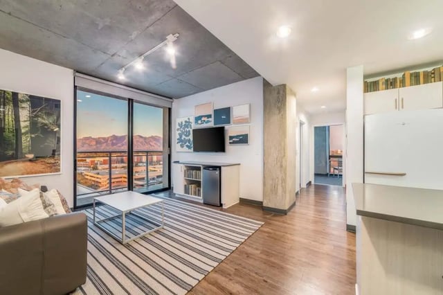 Living area with couch coffee table and city view living room at Malibu Tucson Apartments in Tucson Student Accommodation