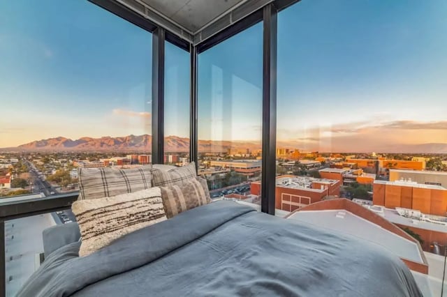 Bed with pillows and mountain view bedroom at Malibu Tucson Apartments in Tucson Student Accommodation