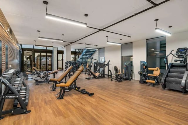 Gym equipment dumbbells benches stairs gym at Malibu Tucson Apartments in Tucson Student Accommodation