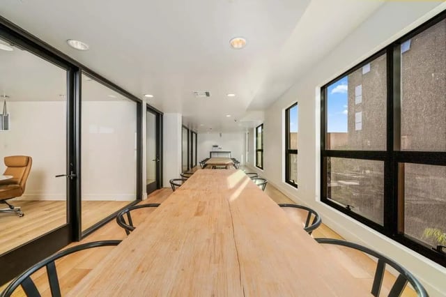 Long wooden table with chairs study area at Malibu Tucson Apartments in Tucson Student Accommodation
