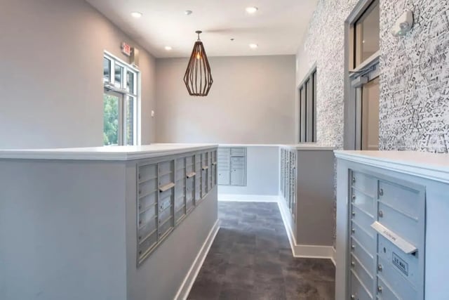 Mailboxes and patterned wallpaper in hallway exterior at The Eastern On 10th in Greenville Student Accommodation