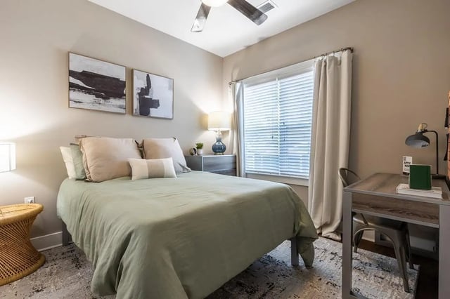 Bed with desk and abstract art bedroom at The Eastern On 10th in Greenville Student Accommodation