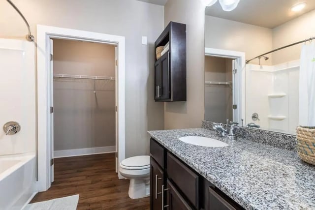 Toilet sink vanity closet shower bathtub bathroom at The Eastern On 10th in Greenville Student Accommodation