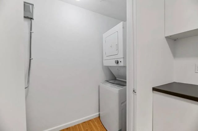 Stacked washer dryer unit and electrical panel laundry room at Green Spring in San Marcos Student Accommodation