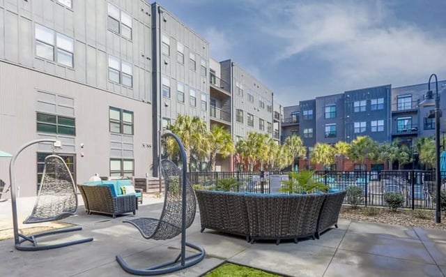 Outdoor lounge chairs and sofa exterior at Greene Crossing in Columbia Student Accommodation