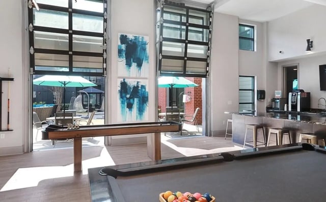 Pool table shuffleboard bar coffee makers common area at Greene crossing flats in Columbia Student Accommodation