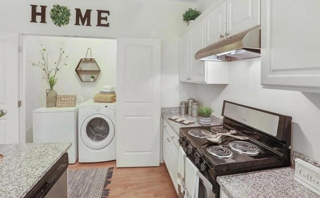 Washing machines stove and cabinets kitchen at Greene crossing flats in Columbia Student Accommodation