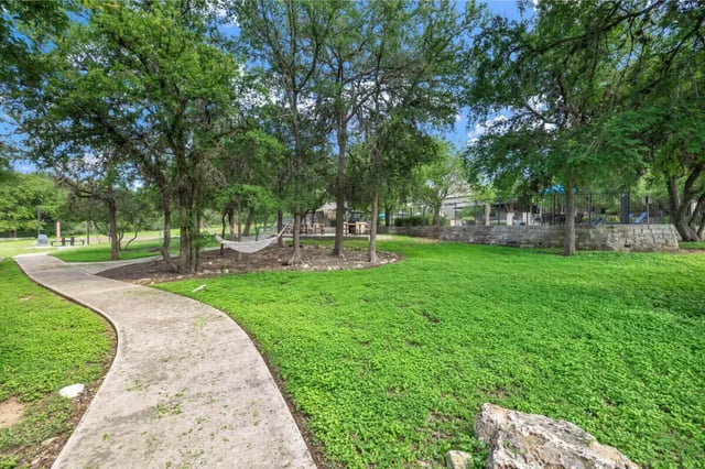 Pathway hammock and picnic tables outdoors living area at The Ranch Student Apartments in San Marcos Student Accommodation