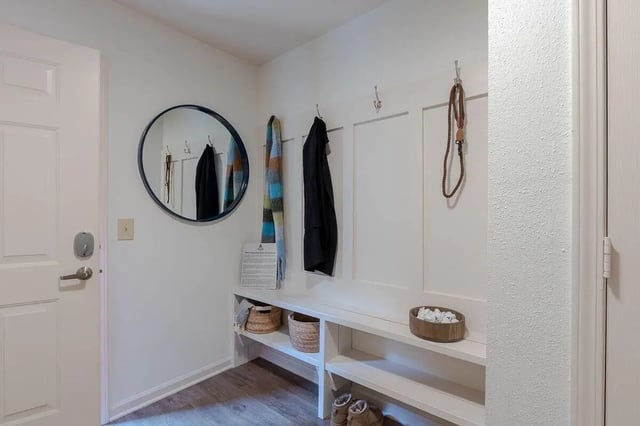 Bench mirror hooks coats baskets entryway at The View Apartments in State College Student Accommodation