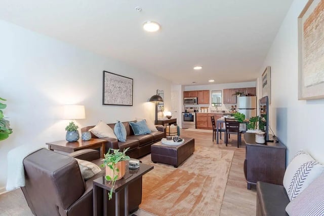 Leather sofa ottoman dining area kitchen living room at The View Apartments in State College Student Accommodation