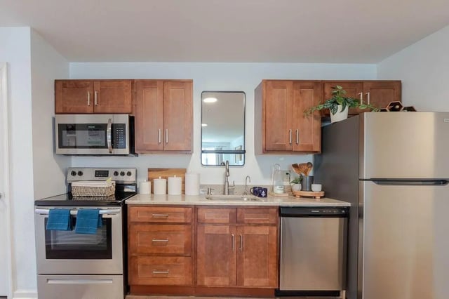 Microwave stove cabinets refrigerator dishwasher kitchen at The View Apartments in State College Student Accommodation