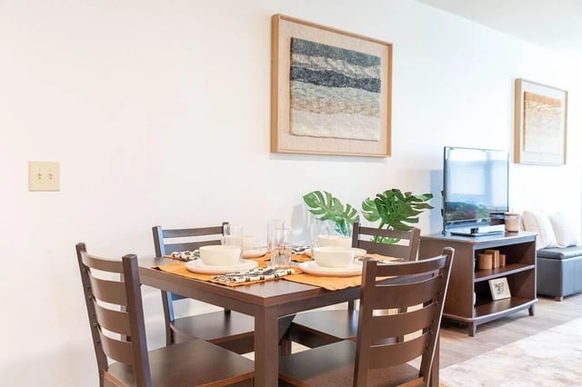 Dining table with chairs and TV living room at The View Apartments in State College Student Accommodation