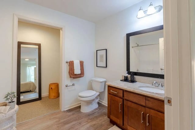 Toilet vanity sink towels and mirror bathroom at The View Apartments in State College Student Accommodation