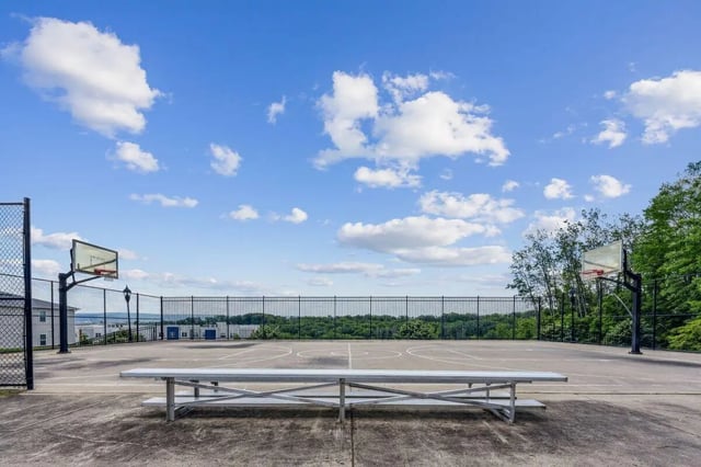 Basketball court with bleachers and hoop. Playing area at The View Apartments in State College Student Accommodation
