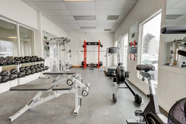 Dumbbells weight bench treadmill rowing machine gym at Alpine Chalet in Rexburg Student Accommodation