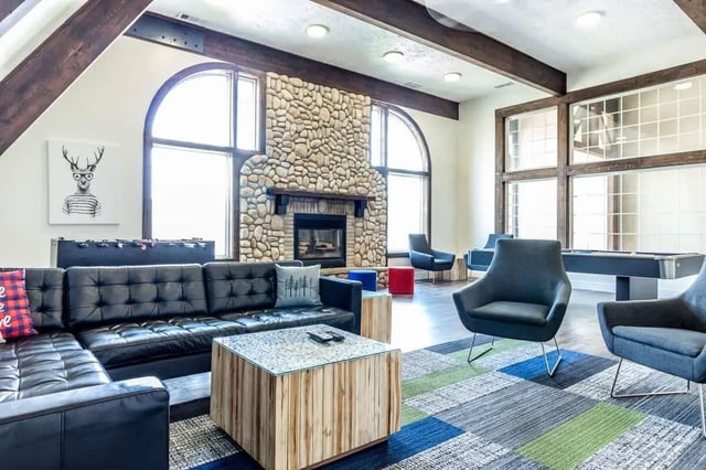 Leather sectional sofa foosball pool living room at Alpine Chalet in Rexburg Student Accommodation