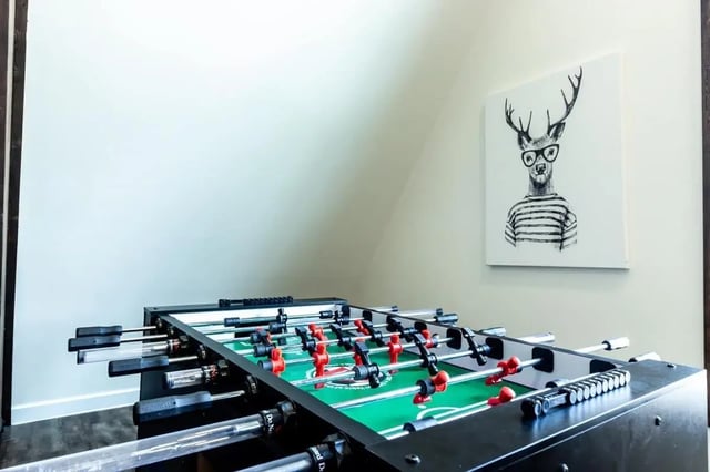 Foosball table artwork of deer playing area at Alpine Chalet in Rexburg Student Accommodation