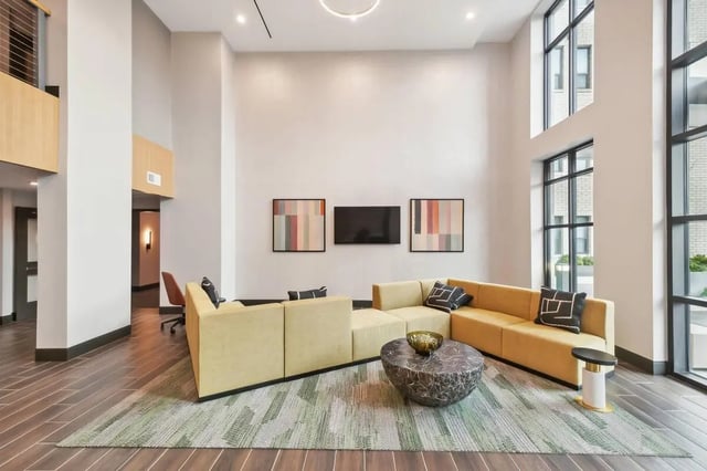 Sofa and coffee table in modern living area living room at The Main on University in Fairfax Student Accommodation
