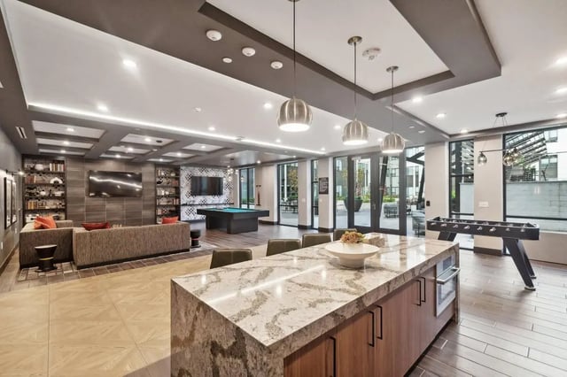 Lounge with pool table and foosball game at The Main on University in Fairfax Student Accommodation