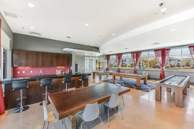 Bar pool tables and shuffleboard common area at The Avenue at Orono in Orono Student Accommodation