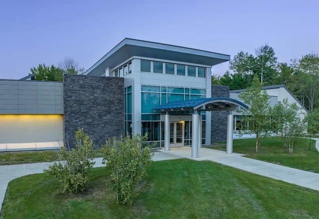Modern building entrance with glass and stone exterior exterior at The Avenue at Orono in Orono Student Accommodation