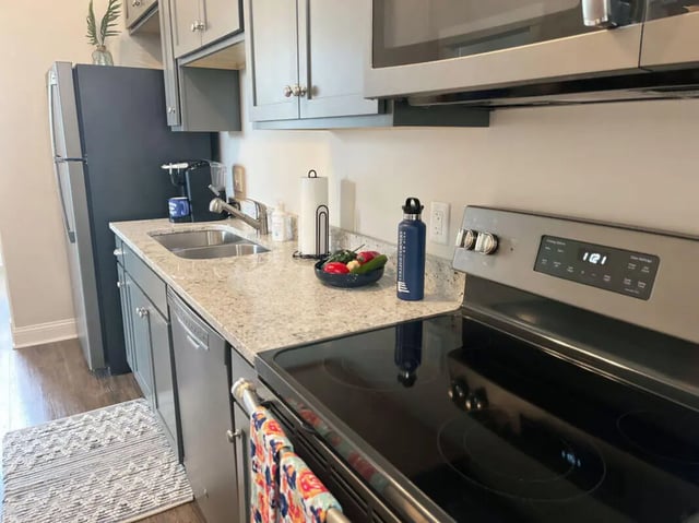 Stainless steel appliances sink and countertops kitchen at College Corners on High in Farmville Student Accommodation