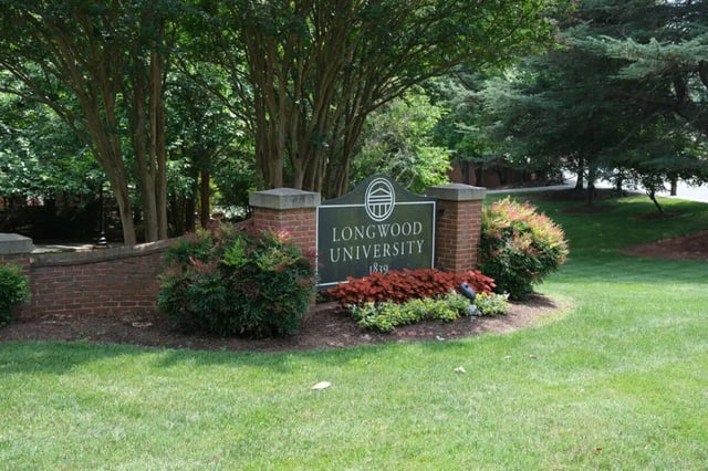 Longwood University sign with brick posts exterior at College Corners on High in Farmville Student Accommodation