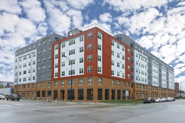 Modern multi story building with red accents exterior at 8N Lofts in Lincoln Student Accommodation