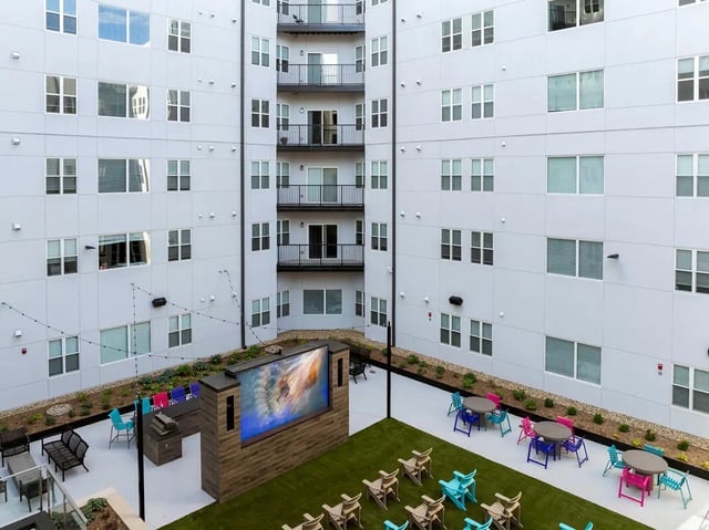 Outdoor movie screen and seating area exterior at Atmosphere Lincoln in Lincoln Student Accommodation