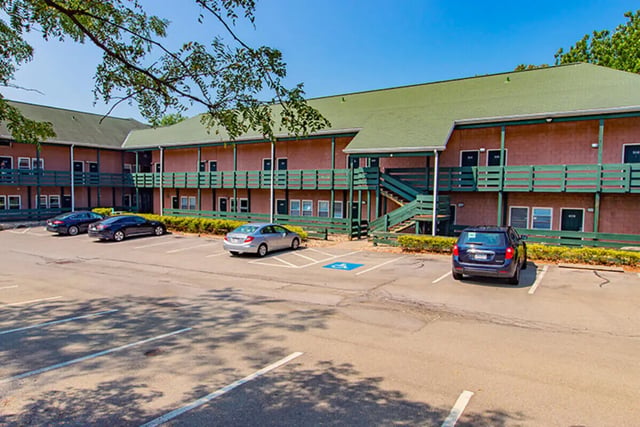 Cars parked by apartment building exterior at Campus Side in Slippery Rock Student Accommodation