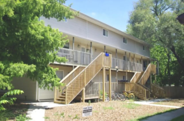 Apartment building with wooden stairs and balconies exterior at Denice.com in Columbia Student Accommodation