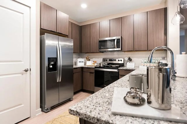 Stainless steel refrigerator microwave stove cabinets kitchen at The Indy in Marietta Student Accommodation