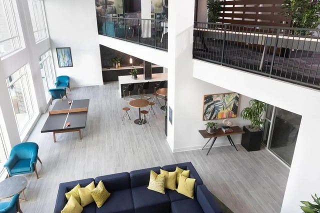 Ping pong table sofas chairs bar kitchen common area at The Indy in Marietta Student Accommodation