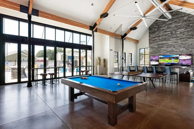 Pool table ping pong tables TVs lounge area Common room at University Trails Apartments in Ann Arbor Student Accommodation