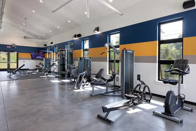 Weight machines and exercise bikes gym at University Trails Apartments in Ann Arbor Student Accommodation