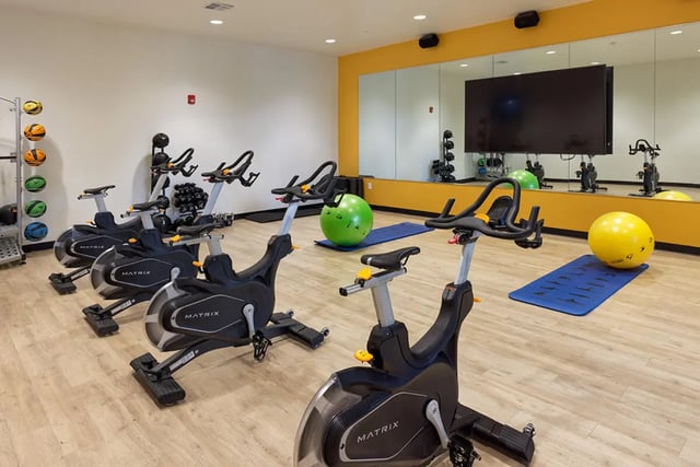 Exercise bikes yoga mats and stability balls gym at University Trails Apartments in Ann Arbor Student Accommodation