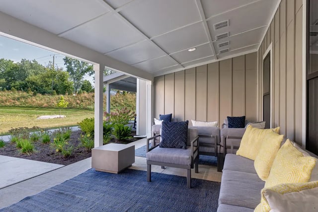 Outdoor seating with cushions and coffee table exterior at University Trails Apartments in Ann Arbor Student Accommodation