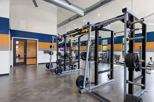 Weight racks barbells and equipment gym at University Trails Apartments in Ann Arbor Student Accommodation