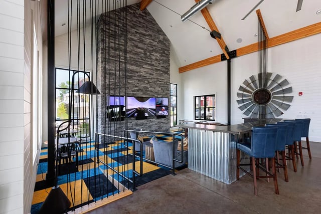 Bar stools at a corrugated metal bar living room at University Trails Apartments in Ann Arbor Student Accommodation