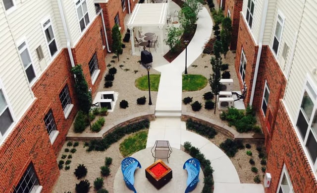 Courtyard with seating BBQ and gazebo exterior at University Edge Apartments in Akron Student Accommodation