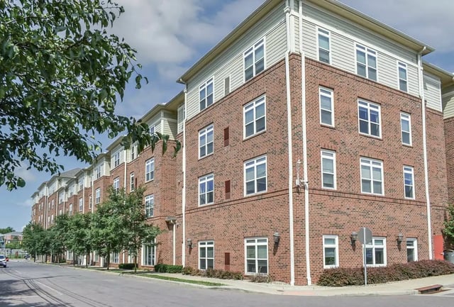 Brick apartment building with many windows exterior at University Edge Apartments in Akron Student Accommodation