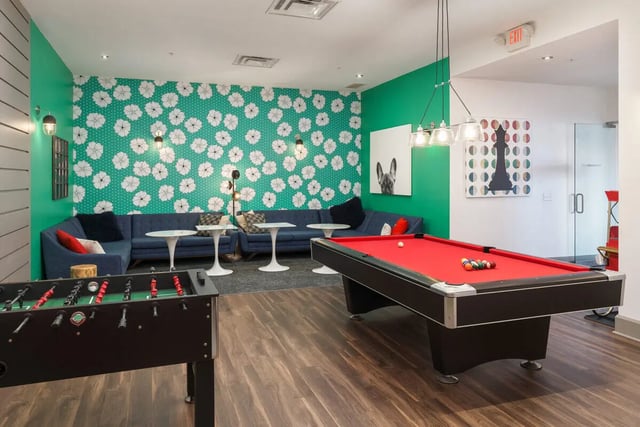 Foosball table pool table couches living room at The Summit at Coates Run in Athens Student Accommodation