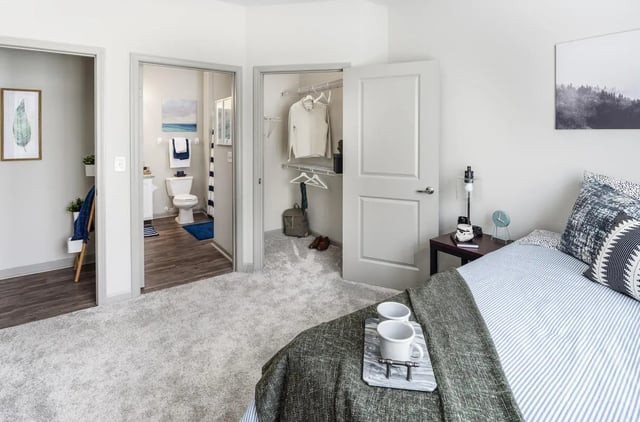 Bed with bathroom and closet bedroom at The Summit at Coates Run in Athens Student Accommodation