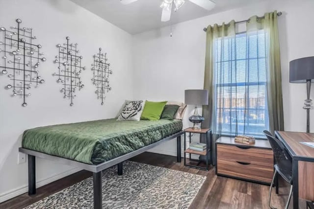 Bed pillows rug desk lamp and window bedroom at The Rendezvous Apartments in Edmond Student Accommodation