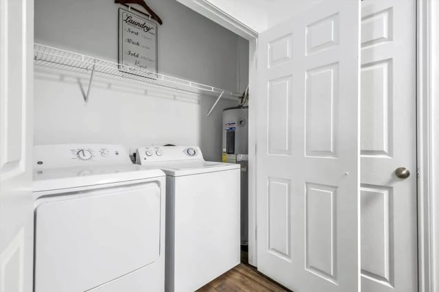 Washer dryer water heater laundry sign closet interior at The Rendezvous Apartments in Edmond Student Accommodation