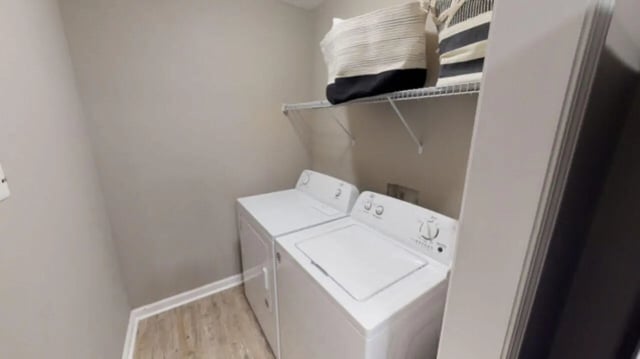 Two white washers and dryer baskets laundry area at Hillside Commons in Tuscaloosa Student Accommodation