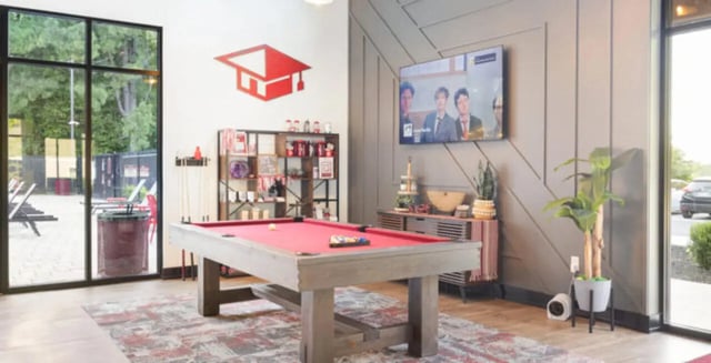 Pool table shelving and TV living area at Hillside Commons in Tuscaloosa Student Accommodation