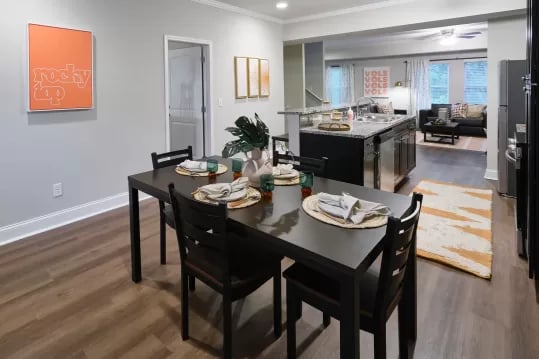 Dining table with place settings and chairs dining area at Knox Ridge in Knoxville Student Accommodation