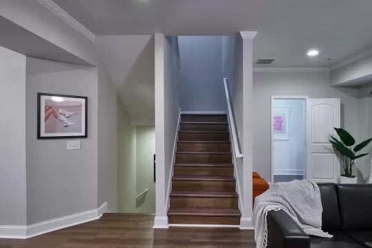 Stairs artwork doorway living room exterior at Knox Ridge in Knoxville Student Accommodation